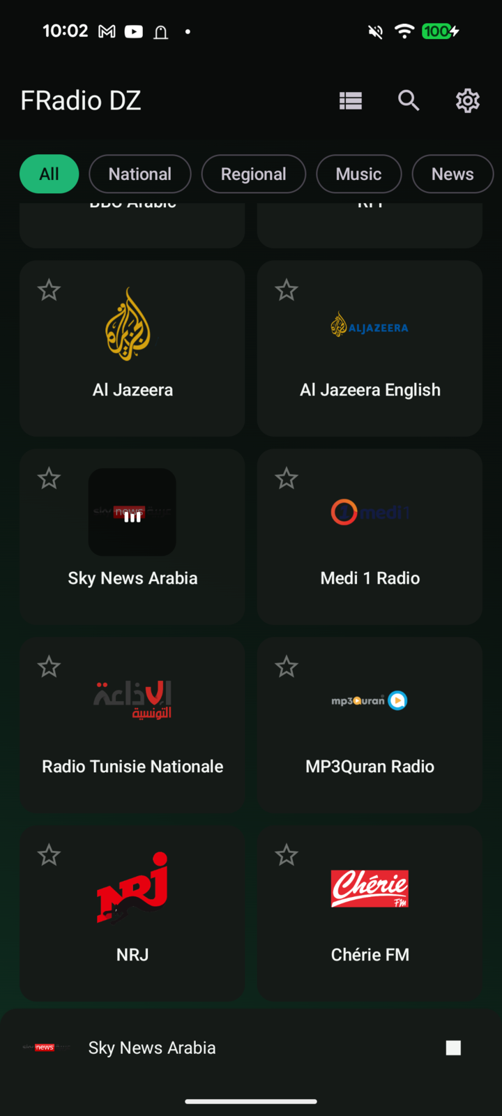 FRadio DZ station grid scrolled to the international stations: Al Jazeera, Al Jazeera English, Sky News Arabia, Medi 1, Radio Tunisie Nationale, MP3Quran, NRJ and Chérie FM, with Sky News Arabia playing in the bar at the bottom